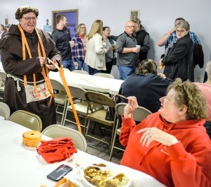 Fish Friar Mike Conrad and Sue Hershman split tickets for the split the pot drawing.