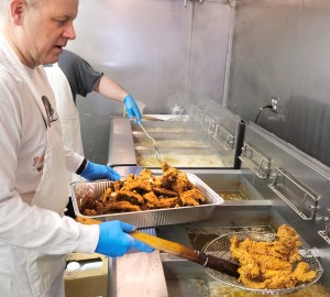 Steve Dethlefs drains a basket of hot fried fish.