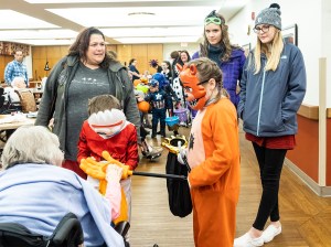 Kids getting treats ad Good Shepherd retirement