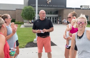 Man with group talking.